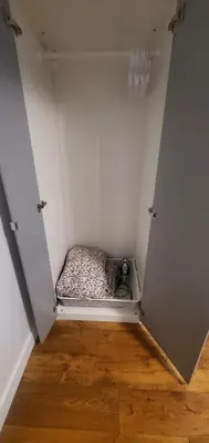 a small room with a bed in a wall at Spacious Guest Suite in Hamilton