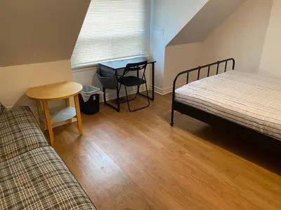a room with two beds and a table and a tableablish at Quad Room with Private Bathroom 536A-Two Bedrooms in Toronto