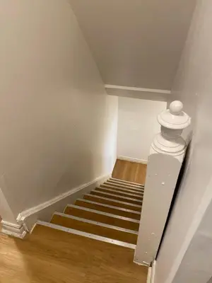a staircase in a room with a white ceiling at Quad Room with Private Bathroom 536A-Two Bedrooms in Toronto