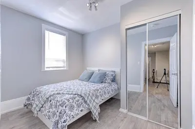a bedroom with a bed and a mirror at Niagara Falls-Toronto-45 Min Drive- 26 OOOO75-Max 8 in Hamilton