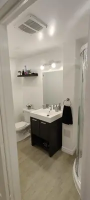 a bathroom with a sink and a mirror at Lovely apartment house in Grimsby