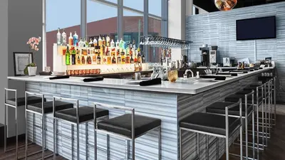 a bar with a bunch of bottles of alcohol at 2 Bedroom, 2 Bath Stunning Condo - heart of Kitchener Downtown in Kitchener