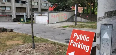 a sign that says public parking on a street at Margie Townhome Suites in Toronto