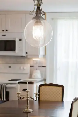 a dining room table with a chandelier in a kitchen at Wine Country 4 bedrooms in Wellington