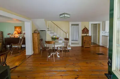 a living room with a table and chairs and a kitchen at Wine Country 4 bedrooms in Wellington