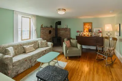 a living room with a couch and a chair at Wine Country 4 bedrooms in Wellington