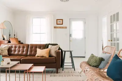 a living room with a couch and a table at Town & Trail - Walkable Wellington Charmer in Wellington