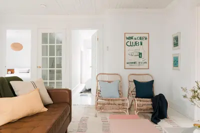 a living room with a couch and two chairs at Town & Trail - Walkable Wellington Charmer in Wellington