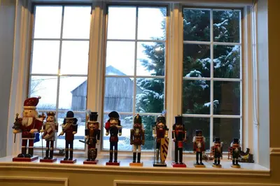 a group of wooden figurines sitting on a window sill at Hidden Farm Escape in the Heart of Kawarthas in Beaverton