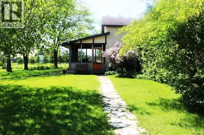 a house with a walkway leading into a yard at Hidden Farm Escape in the Heart of Kawarthas in Beaverton