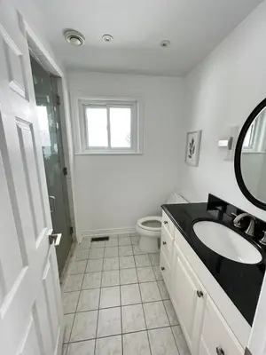 a white bathroom with a sink and a toilet at Letitia Heights !E Spacious and Quiet Private Bedroom with Private Bathroom in Barrie