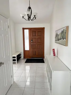 a room with a door and a tiled floor at Letitia Heights !F Spacious and Stylish Private Bedroom with Shared Bathroom in Barrie