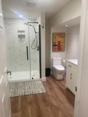 a bathroom with a shower and a toilet at Centre Gate House Licence# 117-2023 in Niagara on the Lake