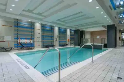 a large swimming pool in a large building at City Centre Lodge ( Downtown) in Mississauga