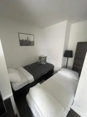 a room with two beds in a room with at Luxury 3-Beds Apartment in Yorkville with the Best City View in Downtown Toronto in Toronto