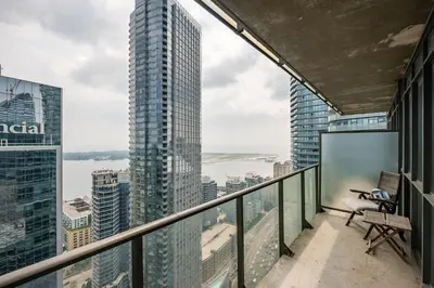 a balcony with a view of a city at 1BR Luxury Condo - Downtown Toronto in Toronto