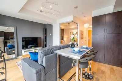 a living room with a couch and a table at 1BR Luxury Condo - Downtown Toronto in Toronto