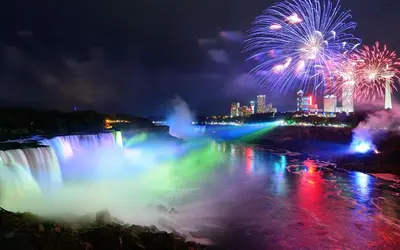 a firework display over the niagara falls at night at Cozy 1-bedroom loft with falls view 4mins to falls in Niagara Falls