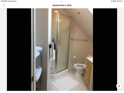a bathroom with a shower and a toilet at Cozy 1-bedroom loft with falls view 4mins to falls in Niagara Falls