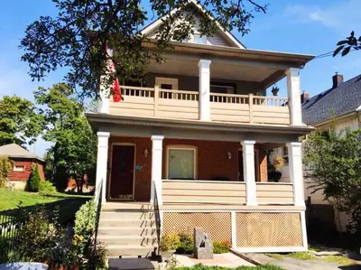 a house with a large deck on top of it at Two bedrooms unit with jacuzzi and great view in Niagara Falls