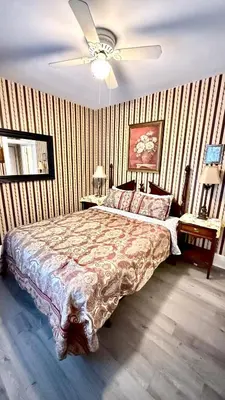 a bedroom with a bed and a ceiling fan at Two bedrooms unit with jacuzzi and great view in Niagara Falls