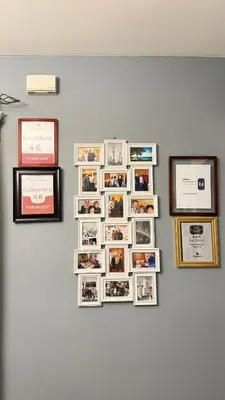 a group of photos on a wall with pictures at Adorable 2-bedroom unit with jacuzzi beside falls in Niagara Falls