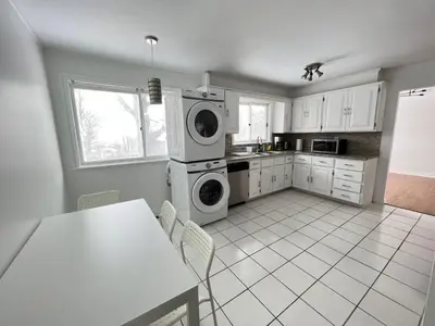 a kitchen with a washer and dryer in it at Letitia Heights !C Quiet and Modern Private Bedroom with Shared Bathroom in Barrie