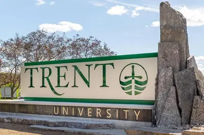 a sign for the front of a treatment university at Private 2-Bedroom Minutes From Trent University in Peterborough