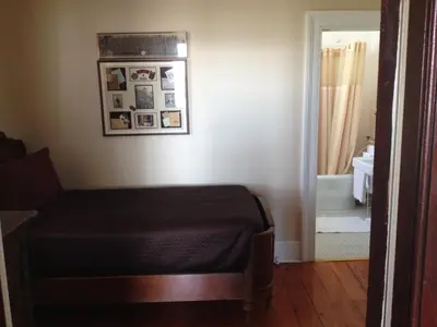 a bedroom with a bed and a bathroom at Stevenson Farms-Harvest Spa B & B in Alliston