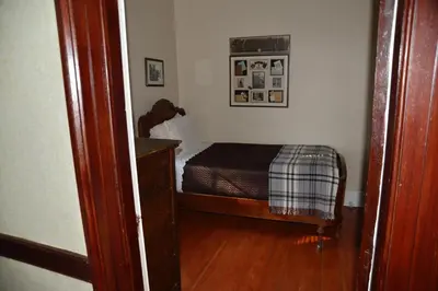 a small bedroom with a bed in a room at Stevenson Farms-Harvest Spa B & B in Alliston