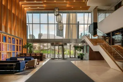 a lobby with a staircase in a building at Delta Hotels by Marriott Toronto in Toronto