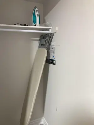 a white refrigerator with a shelf on the wall at Brand New, cozy 2 Bdrm Bsmnt Apt in Mississauga