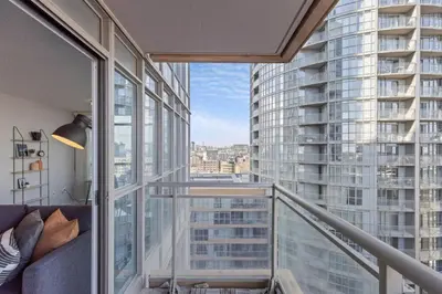 a balcony with a view of a tall building at Work From home with Parking WIFI and CN Tower View in Toronto