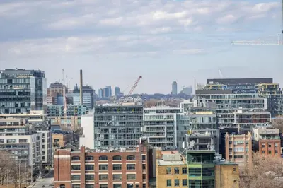a view of a city with tall buildings at Work From home with Parking WIFI and CN Tower View in Toronto