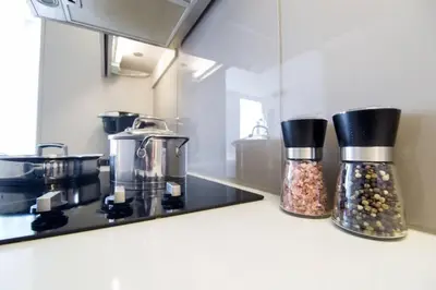 a kitchen counter with two jars of spices on it at Cozy 1 BR Air mattress CN Tower Ent District MTCC in Toronto