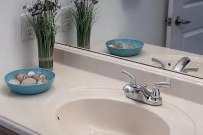 a bathroom counter with a sink and a mirror at 3BR Casa close to Woodbine Beach with deck area and WFH in Toronto
