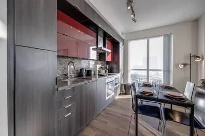 a kitchen with a table and a dining room at Exec 2BR 2BTH w Million Dollar View of CN tower in Toronto