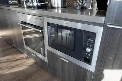 a microwave oven in a kitchen with a counter at Exec 2BR 2BTH w Million Dollar View of CN tower in Toronto