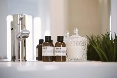 three bottles of oils sitting on a bathroom counter at Skyline Waterfront 2BR plus 2BA wParking near MTCC in Toronto