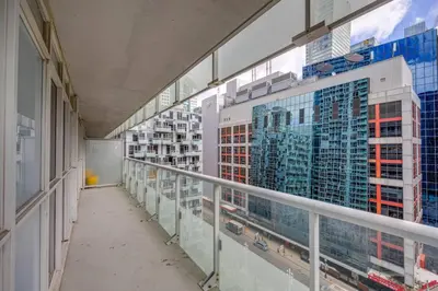 a hallway of a building with glass windows at 2BR Fantastic View of CN Tower and Roger Centre in Toronto