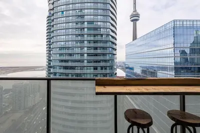 a view of the cn tower from the balcony of a building at Urban Lifestyle 1BR Suite w CN Tower and Lake view in Toronto