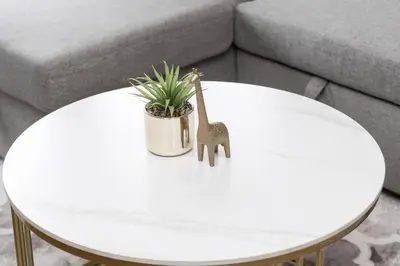 a white coffee table with a toy giraffe on it at Urban Lifestyle 1BR Suite w CN Tower and Lake view in Toronto