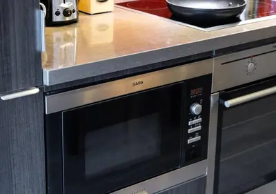 a microwave oven in a kitchen with a counter at Welcoming Downtown Condo with WFH setup Balcony in Toronto