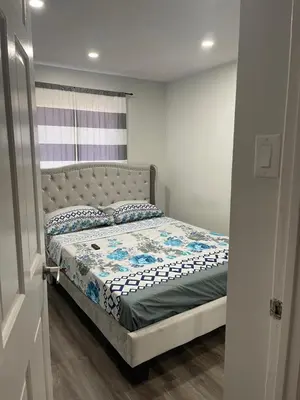 a bedroom with a bed in a room at Triple M Lodge Double in Mississauga