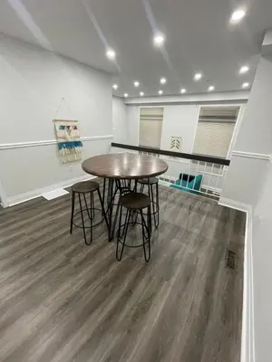 a dining room with a table and chairs in a room at Triple M Lodge Double in Mississauga