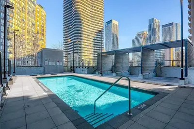 a swimming pool in a city with tall buildings at Luxury view in Toronto Downtown 3 Bedroom 2.5 Bathroom 1 Parking in Toronto