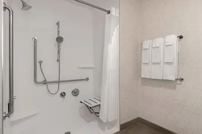 a bathroom with a shower with a shower curtain at Holiday Inn Express & Suites St Thomas in Saint Thomas