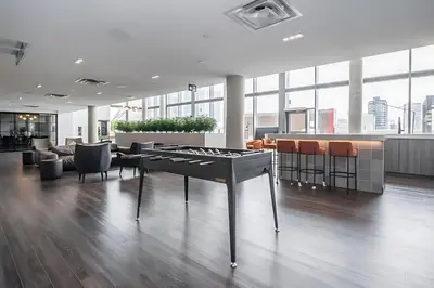 an office with a table in the middle of a room at Luxurious 1BR Condo - Stunning City Views in Kitchener
