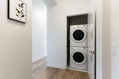a laundry room with a washer and dryer at Cozy & Contemporary Suite - Easy Access to Everything in Richmond Hill