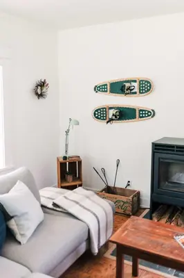 a living room with a couch and a fireplace at The Beachside Burrow - Next to Sandbanks w Hot Tub in West Lake
